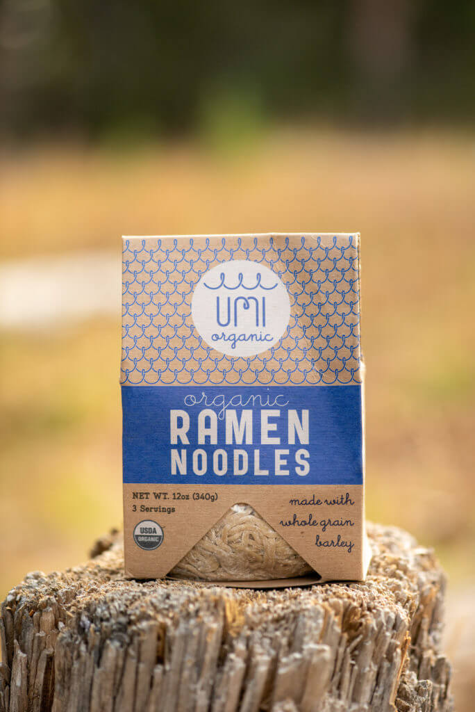 Umi Organic Ramen Noodles on a stump.